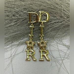 Christian Dior letter earrings